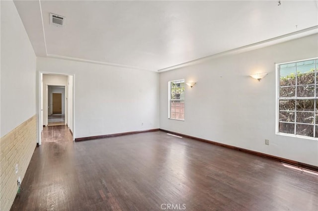 10018 San Vincente Ave, South Gate, CA 90280 - spare room featuring wood finished floors and healthy amount of natural light