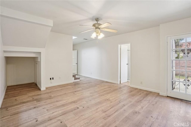 10018 San Vincente Ave, South Gate, CA 90280 - unfurnished living room featuring light wood-style flooring and a ceiling fan