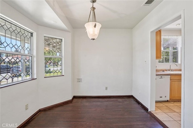 10018 San Vincente Ave, South Gate, CA 90280 - unfurnished dining area featuring light wood-type flooring and a sink