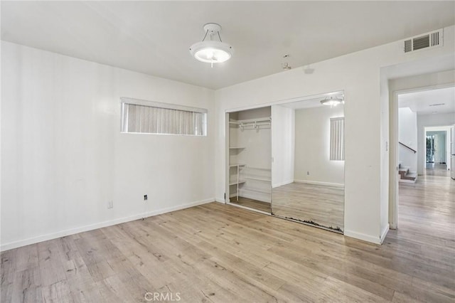 10018 San Vincente Ave, South Gate, CA 90280 - unfurnished bedroom featuring wood finished floors and a closet