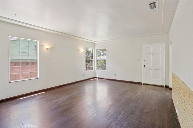 10018 San Vincente Ave, South Gate, CA 90280 - empty room with wood finished floors and baseboards