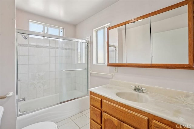 10018 San Vincente Ave, South Gate, CA 90280 - bathroom featuring vanity, tile patterned flooring, and combined bath / shower with glass door