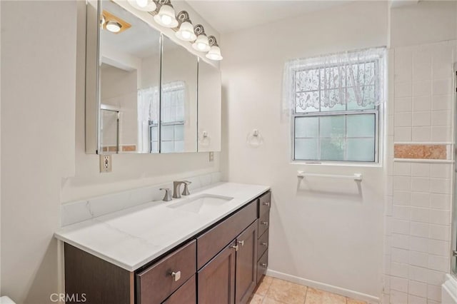 10018 San Vincente Ave, South Gate, CA 90280 - bathroom featuring vanity, a shower, and tile patterned floors