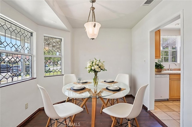10018 San Vincente Ave, South Gate, CA 90280 - dining space with baseboards and light wood-type flooring