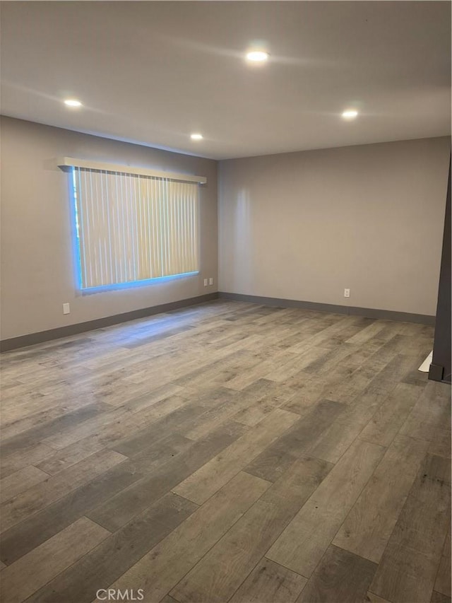 7445 Laurelgrove Ave Unit 2, North Hollywood, CA 91605 - empty room with hardwood / wood-style flooring and recessed lighting