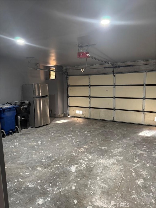 7445 Laurelgrove Ave Unit 2, North Hollywood, CA 91605 - garage with freestanding refrigerator and a garage door opener