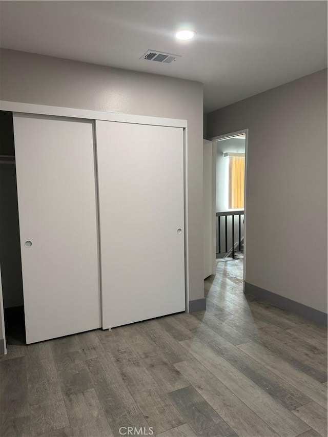 7445 Laurelgrove Ave Unit 2, North Hollywood, CA 91605 - unfurnished bedroom featuring wood finished floors, a closet, and recessed lighting