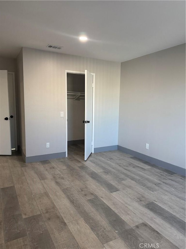 7445 Laurelgrove Ave Unit 2, North Hollywood, CA 91605 - unfurnished bedroom featuring wood finished floors and recessed lighting