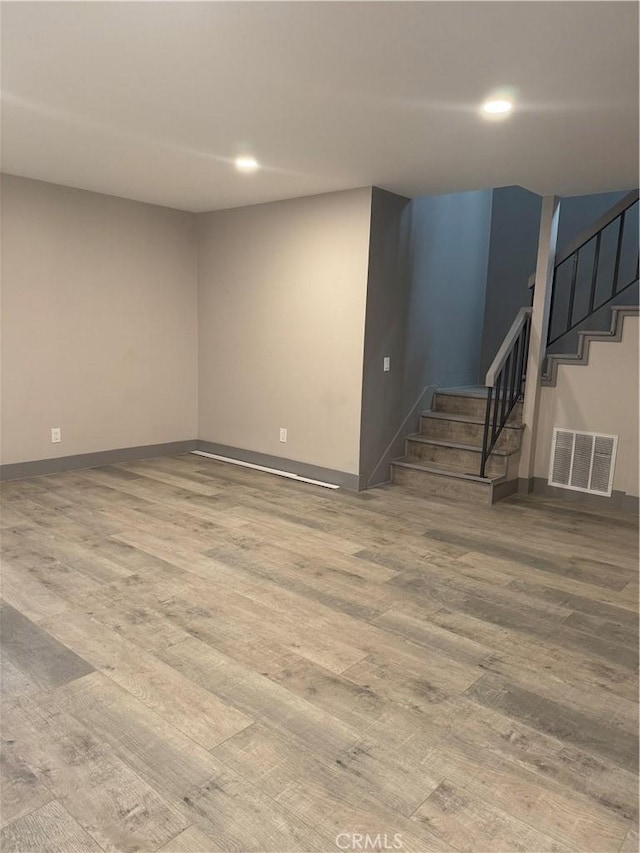 7445 Laurelgrove Ave Unit 2, North Hollywood, CA 91605 - unfurnished living room with wood finished floors, stairs, and recessed lighting
