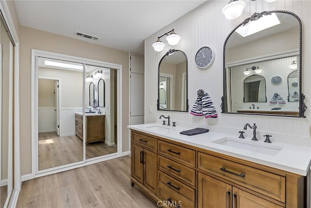 2665 Waverly Ct, Chico, CA 95973 - full bath featuring double vanity and wood finished floors