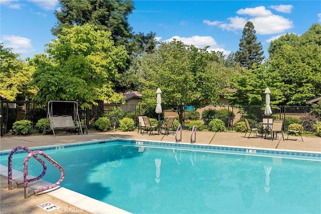 2665 Waverly Ct, Chico, CA 95973 - community pool featuring a patio and view of scattered trees