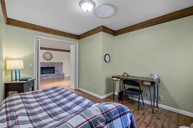 2665 Waverly Ct, Chico, CA 95973 - bedroom featuring wood finished floors and a brick fireplace