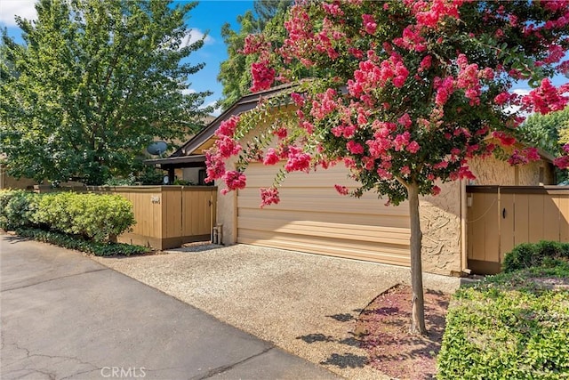 2665 Waverly Ct, Chico, CA 95973 - view of property exterior with driveway, a gate, and a garage