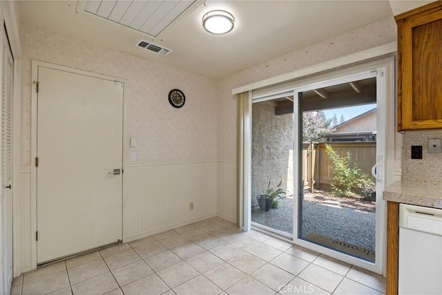 2665 Waverly Ct, Chico, CA 95973 - unfurnished dining area with a wainscoted wall, wallpapered walls, and light tile patterned floors