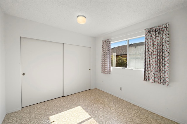 11551 Gladstone Cir, Fountain Valley, CA 92708 - unfurnished bedroom with a closet and a textured ceiling