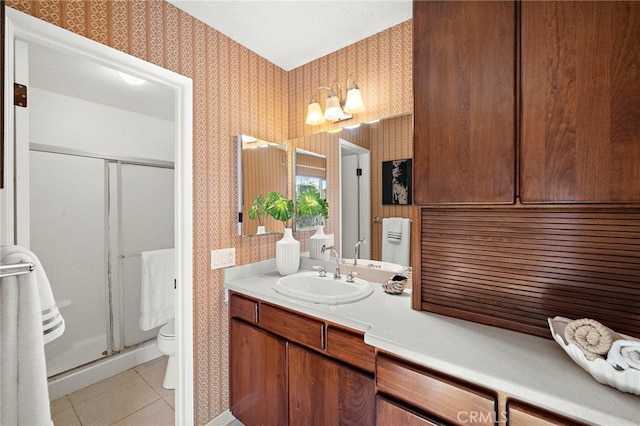 11551 Gladstone Cir, Fountain Valley, CA 92708 - bathroom featuring wallpapered walls, a shower stall, tile patterned floors, and vanity
