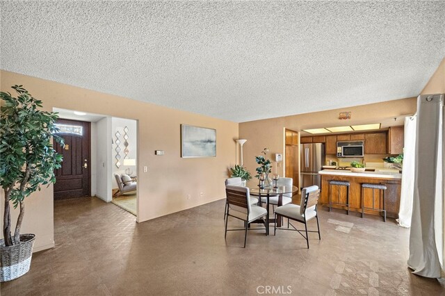 11551 Gladstone Cir, Fountain Valley, CA 92708 - dining room featuring a textured ceiling