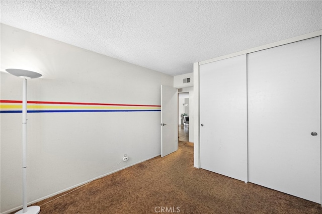 11551 Gladstone Cir, Fountain Valley, CA 92708 - unfurnished bedroom featuring carpet flooring, a textured ceiling, and a closet
