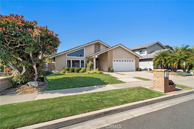 11551 Gladstone Cir, Fountain Valley, CA 92708 - mid-century modern home featuring stucco siding, a garage, a front lawn, and concrete driveway