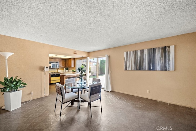 11551 Gladstone Cir, Fountain Valley, CA 92708 - dining room featuring a textured ceiling and baseboards