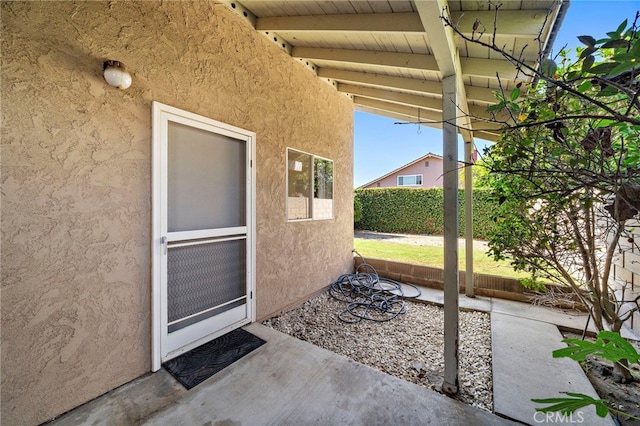 11551 Gladstone Cir, Fountain Valley, CA 92708 - property entrance with stucco siding and a patio