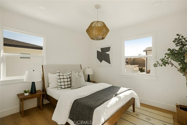 1585 Miramar Dr, Newport Beach, CA 92661 - bedroom featuring baseboards and wood finished floors