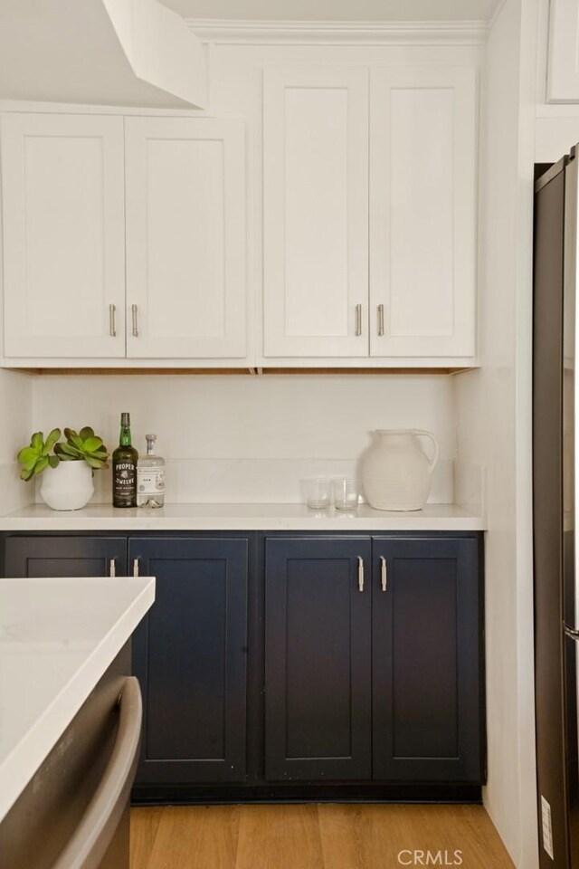 1585 Miramar Dr, Newport Beach, CA 92661 - indoor dry bar featuring freestanding refrigerator and light wood-type flooring