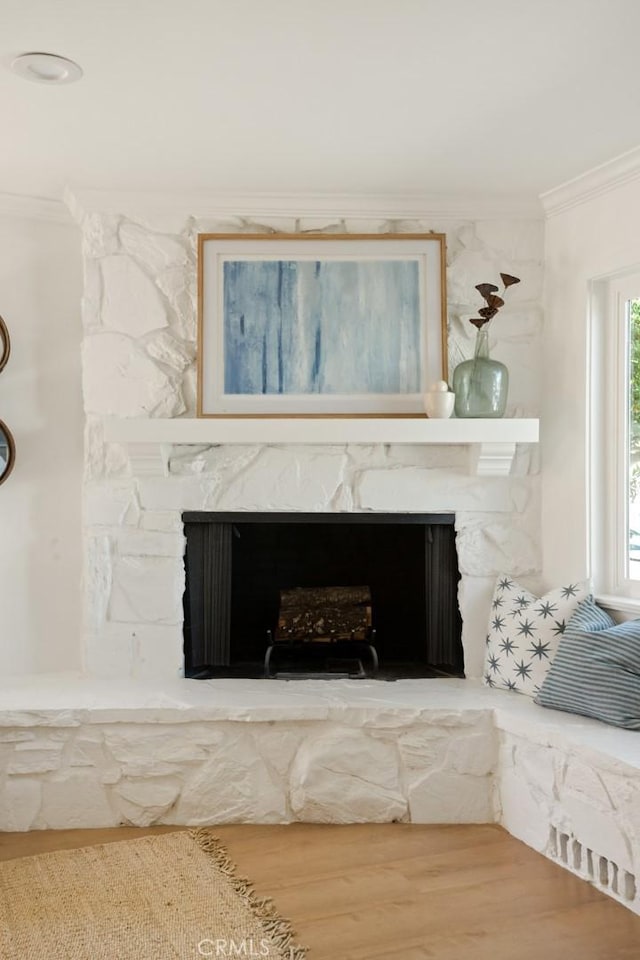 1585 Miramar Dr, Newport Beach, CA 92661 - detailed view of crown molding, a stone fireplace, and wood finished floors