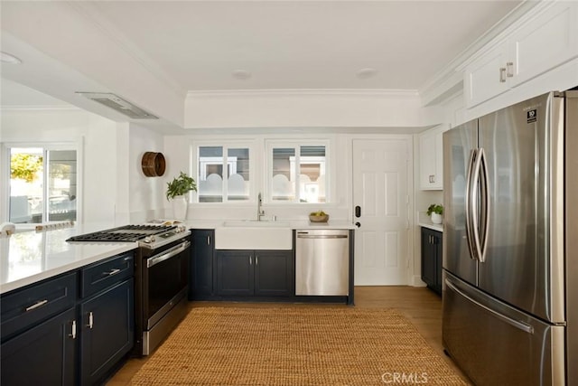 1585 Miramar Dr, Newport Beach, CA 92661 - kitchen featuring stainless steel appliances, light countertops, white cabinets, and crown molding