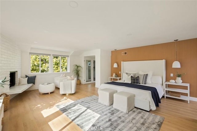 1585 Miramar Dr, Newport Beach, CA 92661 - bedroom featuring wood finished floors and a brick fireplace