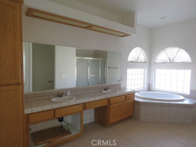 2425 Tokay Rd, Phelan, CA 92371 - bathroom with a shower stall, a garden tub, tile patterned flooring, and double vanity