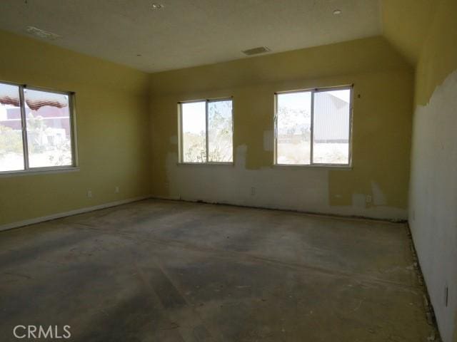2425 Tokay Rd, Phelan, CA 92371 - empty room with plenty of natural light and unfinished concrete flooring