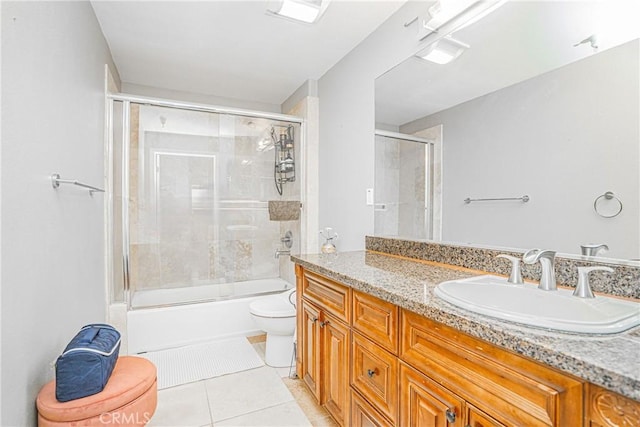 1026 S Oxford Ave Unit 206, Los Angeles, CA 90006 - full bathroom with vanity, tile patterned floors, and combined bath / shower with glass door