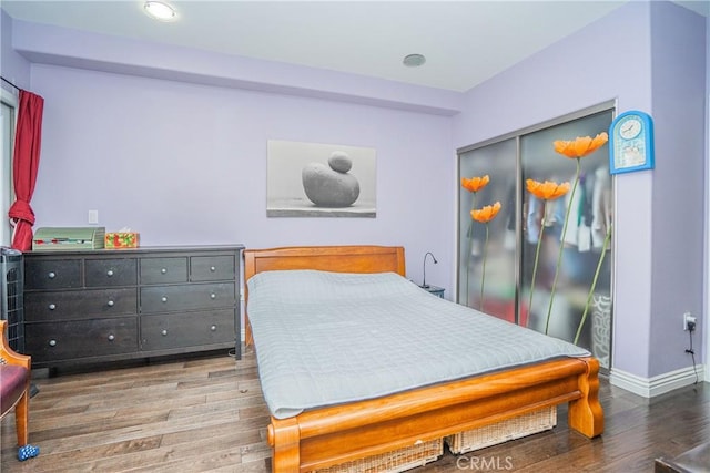 1026 S Oxford Ave Unit 206, Los Angeles, CA 90006 - bedroom with wood finished floors, a closet, and recessed lighting