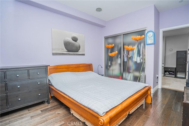 1026 S Oxford Ave Unit 206, Los Angeles, CA 90006 - bedroom with wood finished floors and a closet