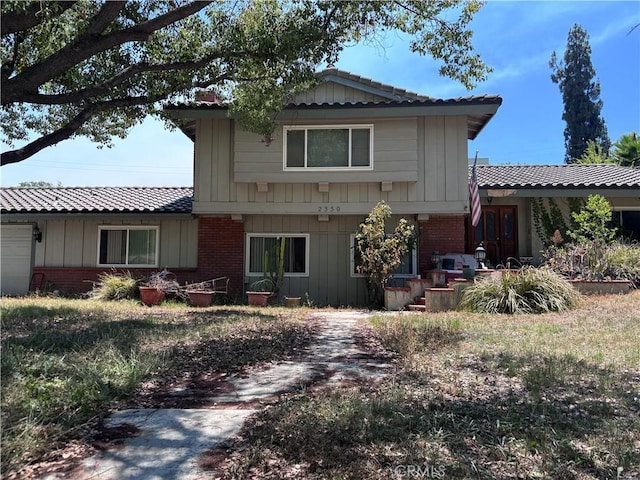 2350 Shadow Hill Dr, Riverside, CA 92506 - view of front of house featuring brick siding and board and batten siding