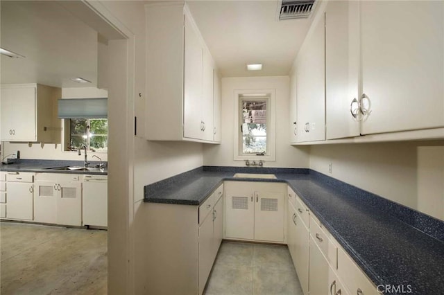1075 Pine Oak Ln, Pasadena, CA 91105 - kitchen featuring dark countertops, white dishwasher, light tile patterned floors, and white cabinetry