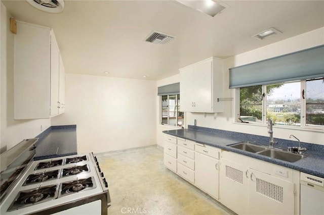 1075 Pine Oak Ln, Pasadena, CA 91105 - kitchen with gas stove, dark countertops, dishwasher, and white cabinetry
