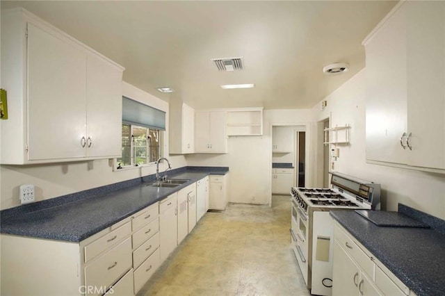 1075 Pine Oak Ln, Pasadena, CA 91105 - kitchen featuring white gas stove, white cabinetry, and dark countertops
