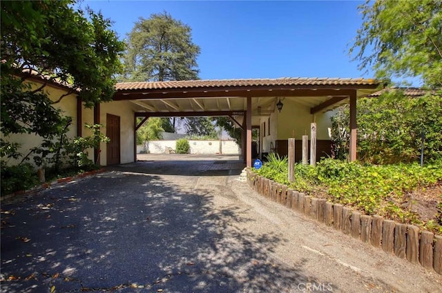 1075 Pine Oak Ln, Pasadena, CA 91105 - view of parking / parking lot with asphalt driveway and a carport