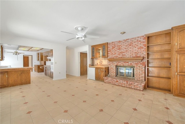2290 Decade Ct, Riverside, CA 92506 - unfurnished living room featuring a ceiling fan and a brick fireplace