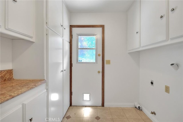 2290 Decade Ct, Riverside, CA 92506 - laundry area with cabinet space, light tile patterned floors, and hookup for an electric dryer