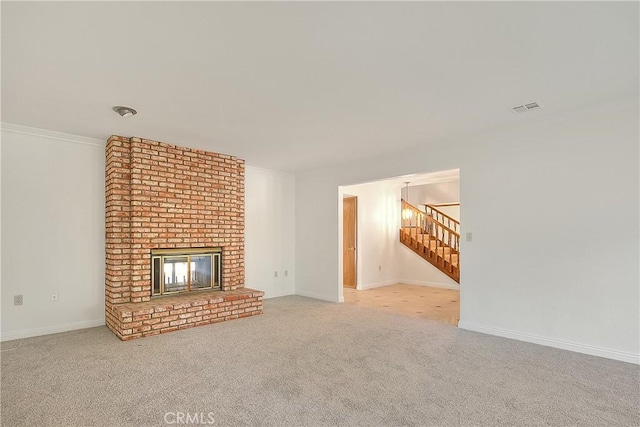 2290 Decade Ct, Riverside, CA 92506 - unfurnished living room with carpet, a brick fireplace, and stairway