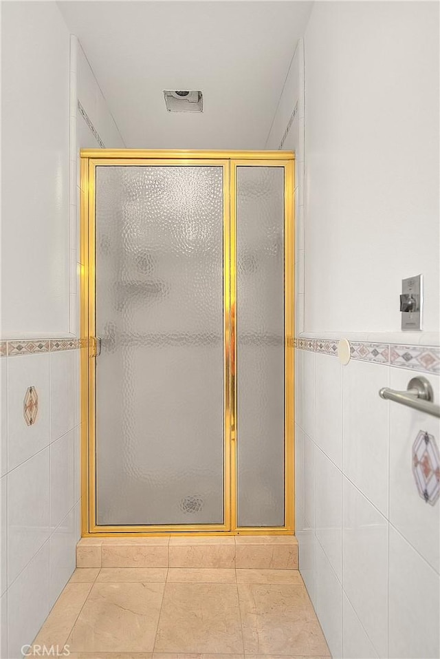 2290 Decade Ct, Riverside, CA 92506 - bathroom with tile walls, a stall shower, and tile patterned flooring
