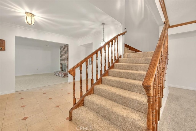 2290 Decade Ct, Riverside, CA 92506 - stairway featuring carpet, crown molding, and a fireplace