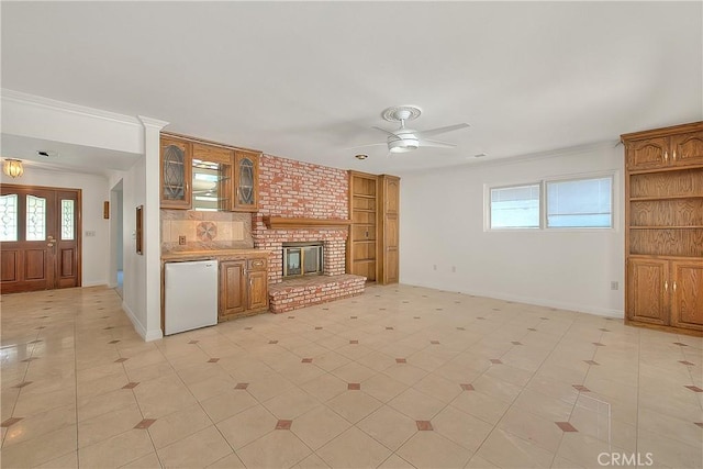 2290 Decade Ct, Riverside, CA 92506 - unfurnished living room featuring a ceiling fan, built in features, and crown molding