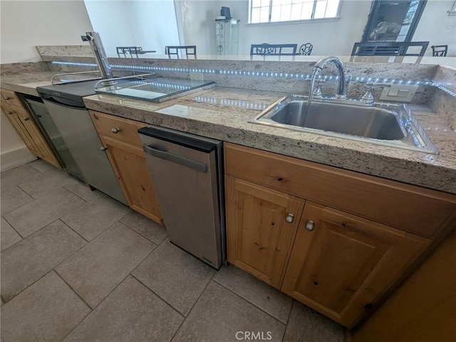 891 W Elberon Ave, San Pedro, CA 90731 - kitchen featuring stainless steel dishwasher, light countertops, and light tile patterned flooring
