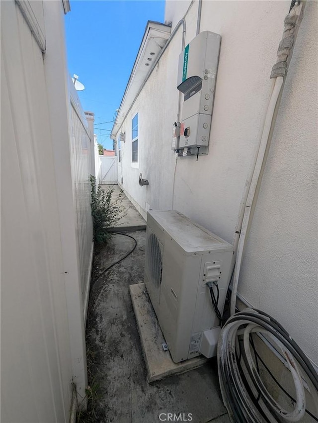 891 W Elberon Ave, San Pedro, CA 90731 - view of side of property featuring an ac unit and stucco siding