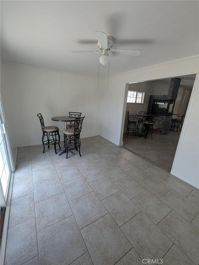 891 W Elberon Ave, San Pedro, CA 90731 - tiled dining room featuring a ceiling fan and crown molding
