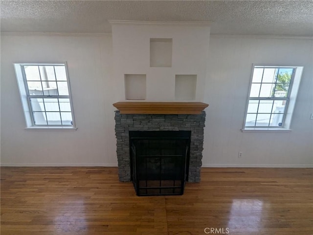 891 W Elberon Ave, San Pedro, CA 90731 - detailed view of wood finished floors, crown molding, a textured ceiling, and a fireplace